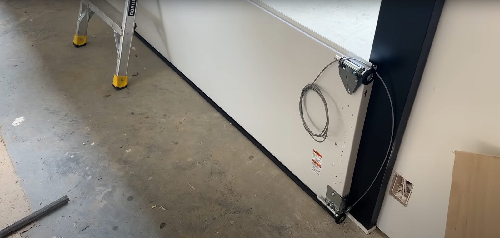 Cracked, dented, or warped garage door panel repaired professionally for smooth functionality and enhanced durability.