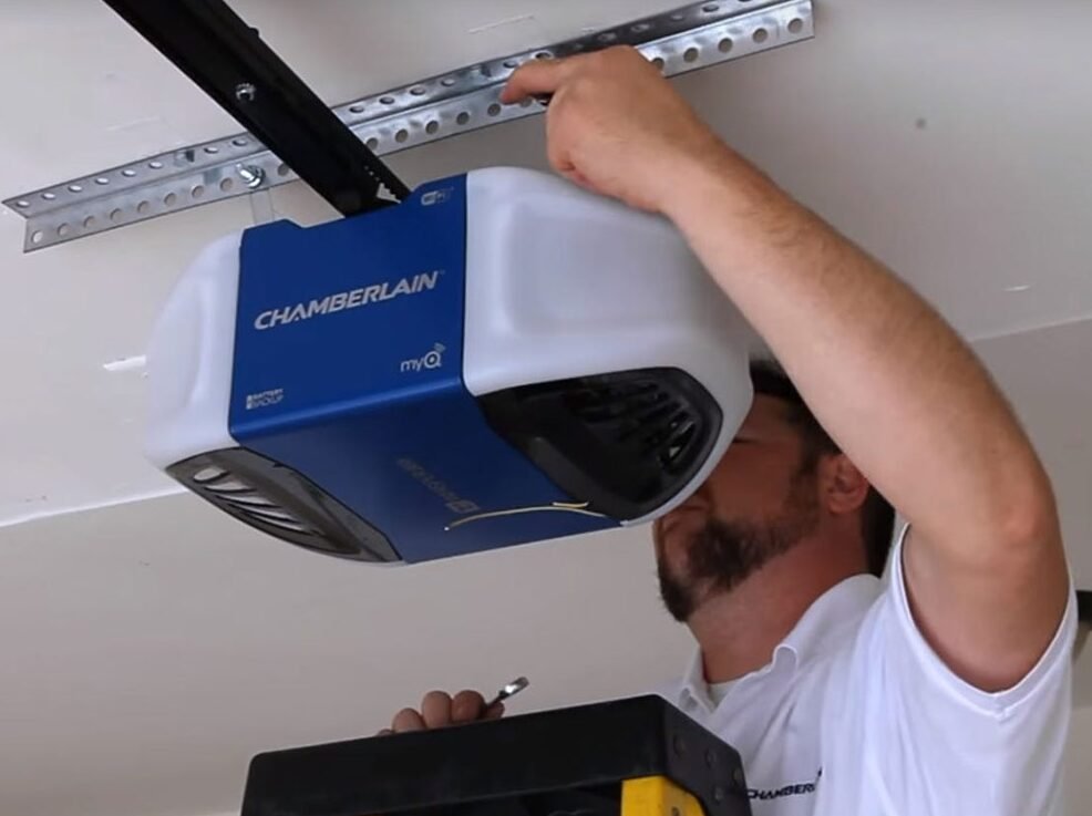 Experienced technician performing garage door opener repair in Holmes Beach