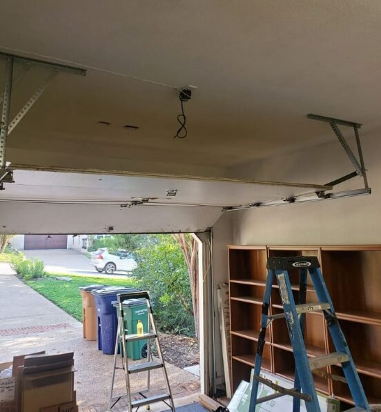 Technician performing garage door repair service in Holmes Beach, showcasing quality and expertise for residential and commercial garage doors.